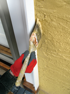 We paint the trim first, and then “cut in” the walls around the trim.