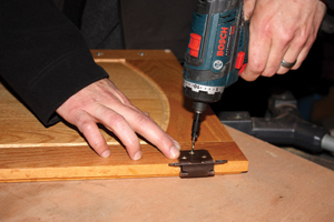 Always predrill the screw holes in hardwood to avoid splitting the wood.
